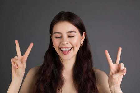 Close up portrait of a cheerful trendy woman with brunette hairの写真素材