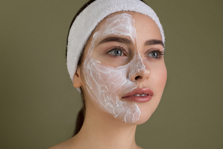 Close up portrait of naked young woman with blue eyes and red lipsの写真素材