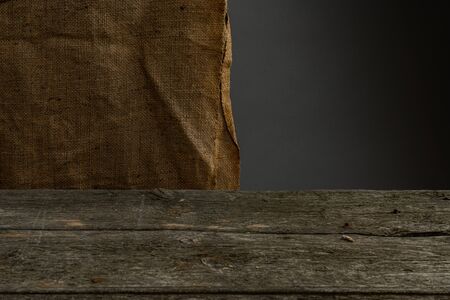 Wooden table, grey wall, bagging background, texture interior empty spaceの写真素材