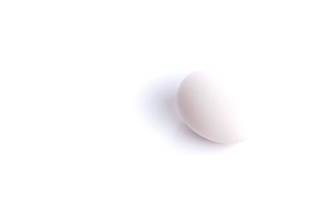 White chicken egg isolated over white background with copyspace