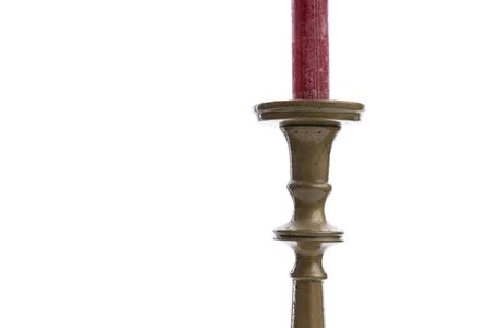 Cropped image of a retro candlestick with red candle isolated on white background with copyspaceの写真素材