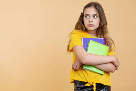 Prepare hard examen concept. Thoughtful puzzled smart clever minded confused crying little girl...