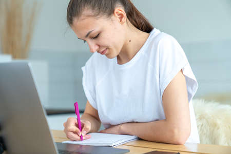 Education, technology, freelance, overwork and people concept - woman or student girl with laptop...
