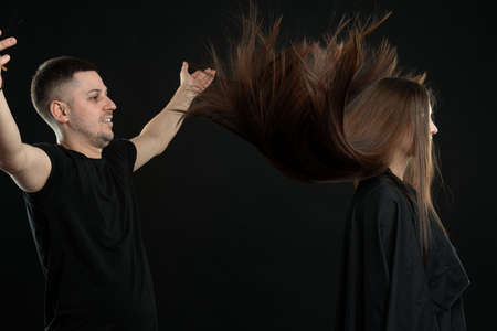 Sensual brunette woman. Young hairdresser, salon and barberの写真素材