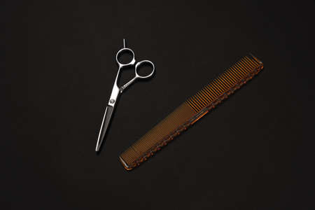 A barber, hairdresser tools close up, isolated on black backgroundの写真素材
