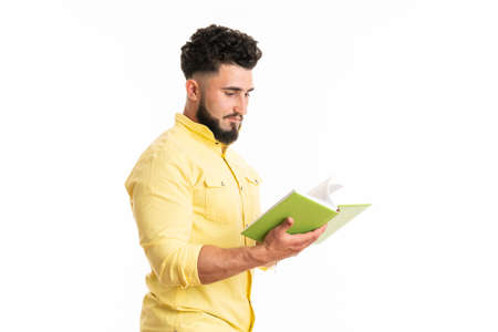 Photo of funny handsome guy holding green book favorite business motivation positive emotionsの写真素材