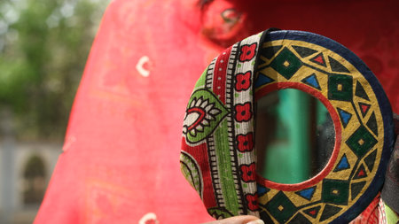 Close-up of traditional indian headdress on red fabric.の写真素材