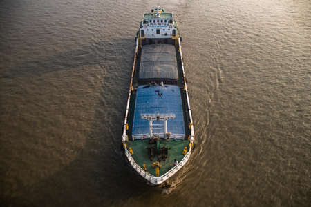 The Freighting transportation on river at sunset.の写真素材