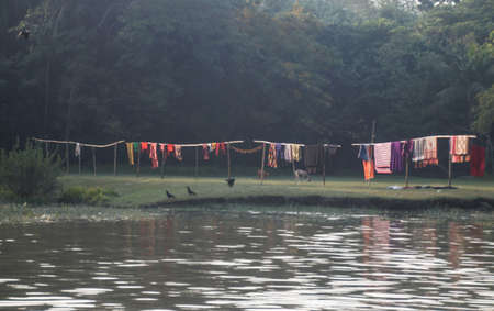 Rural lifestyle besides a river in Bangladesh at Khulna.の写真素材