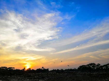 The beautiful reflection of brick field in lake water at sunset.の写真素材