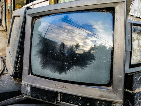 The reflection is like that the broken television is on.の写真素材