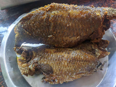 Four Pounds Kalta Fish Fried and cut into two partsの写真素材