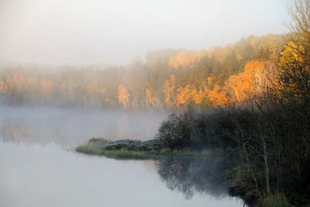 Sunrise over a northern river on a frozen autumn morningの写真素材