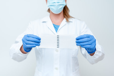 Demonstrating Medical Ideas Presenting New Scientific Discovery Laboratory Presentations Science Discussions Wearing Occupation Workwear Protective Gearsの写真素材
