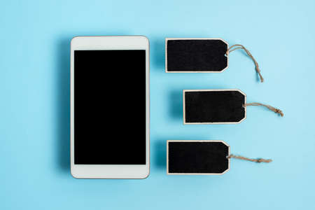 Collection of Real Blank Empty Sticker Card Tag With An Elastic Band On A Different Color Background Containing Modern Gadget Checklist For Labeling Informative Content Purposesの写真素材