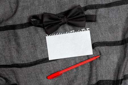 Presenting Everyday Carry Essentials, Clothing Accessory Attachment, Displaying Pocket Contents, Writing Important Notes, Hand Carry Extras, Formal Attire Bow Tieの写真素材