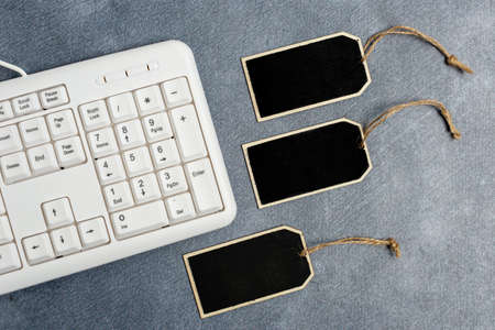 Collection of Real Blank Empty Sticker Card Tag With An Elastic Band On A Different Color Background Containing Modern Gadget Checklist For Labeling Informative Content Purposesの写真素材