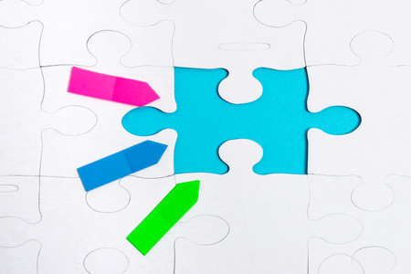Close-Up White Jigsaw Pattern Puzzle Pieces To Be Connected With Missing Last Piece Positioned On A...
