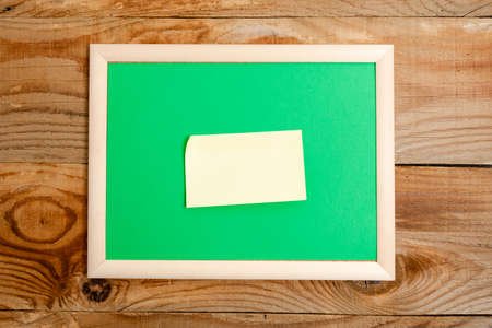 Pinned Variety of Empty Color Paper Sticker Notes Mock Up Used for Content. Paper Notebook Accessories And School Supplies With Mobile Phone Arranged On Different Flat Lay Backgroundsの写真素材