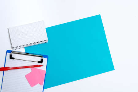 Pinned Variety of Empty Color Paper Sticker Notes Mock Up Used for Content. Paper Notebook Accessories And School Supplies With Mobile Phone Arranged On Different Flat Lay Backgroundsの写真素材