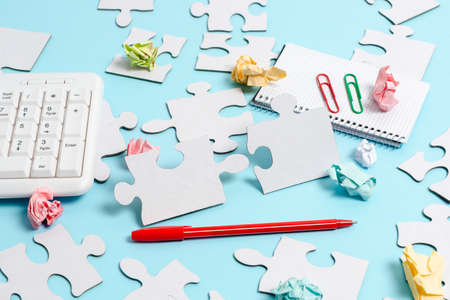 Close-Up White Jigsaw Pattern Puzzle Pieces To Be Connected With Missing Last Piece Positioned On A...