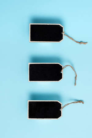 Collection of Real Blank Empty Sticker Card Tag With An Elastic Band On A Different Color Background Containing Modern Gadget Checklist For Labeling Informative Content Purposesの写真素材