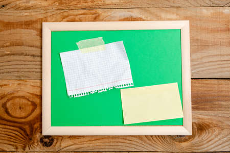 Pinned Variety of Empty Color Paper Sticker Notes Mock Up Used for Content. Paper Notebook Accessories And School Supplies With Mobile Phone Arranged On Different Flat Lay Backgroundsの写真素材