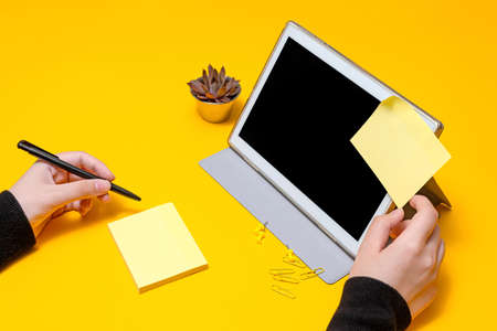 Woman Hand Holding Blank Notes Writing New Messege Updates Ideas Next To Tablet. Lady Palm Showing...