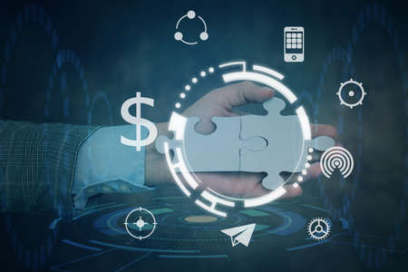 Hand Holding Jigsaw Puzzle Piece Unlocking New Futuristic Technologies. Palm Carrying Puzzles Part...