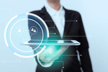 Lady In Suit Standing Presenting Mobile Device Futuristic Interface Technology. Woman In Uniform Holding Phone Showing Modern Digital Display Innovation.の写真素材