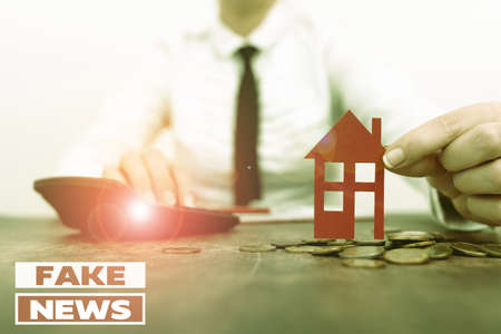 Writing displaying text Fake News. Business concept false information publish under the guise of being authentic news New home installments and investments plans represeneted by ladyの写真素材