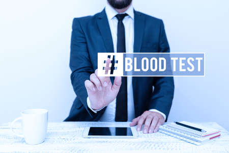 Hand writing sign Blood Test. Internet Concept Extracted blood sample from an organism to perfom a...