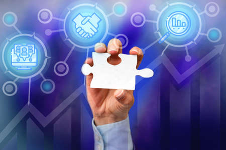Hand Holding Jigsaw Puzzle Piece Unlocking New Futuristic Technologies. Palm Carrying Puzzles Part...