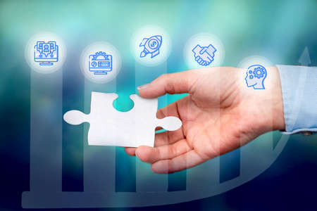 Hand Holding Jigsaw Puzzle Piece Unlocking New Futuristic Technologies. Palm Carrying Puzzles Part...