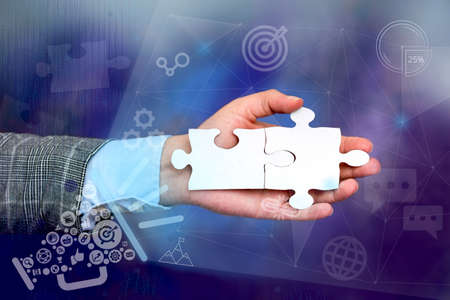 Hand Holding Jigsaw Puzzle Piece Unlocking New Futuristic Technologies. Palm Carrying Puzzles Part...