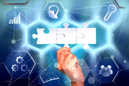 Hand Holding Jigsaw Puzzle Piece Unlocking New Futuristic Technologies. Palm Carrying Puzzles Part...