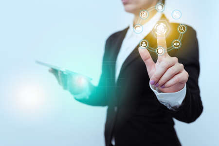 Woman In Suit Side Standing Holding Tablet While Raising Finger Showing Futuristic Interface. Lady...