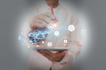 Lady In Suit Holding Phone Performing Futuristic Holographic Image Presentation. Business Woman...