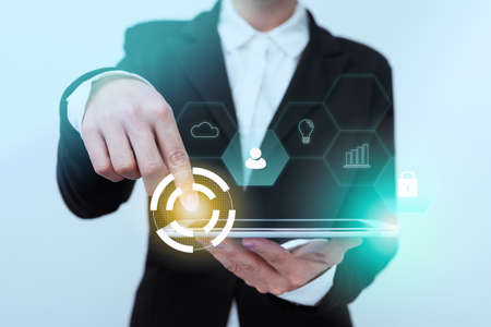 Lady In Suit Standing Pointing On Tablet Showing Futuristic Graphic Interface. Woman In Uniform...