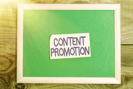 Hand writing sign Content Promotion. Business overview about getting content in front of the right audience Display of Different Color Sticker Notes Arranged On flatlay Lay Backgroundの写真素材