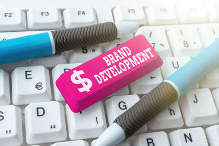 Hand writing sign Brand Development. Business concept improving customers knowledge and opinions of...