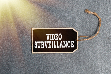 Conceptual caption Video Surveillance. Business approach system of monitoring activity in an area or buildingの写真素材