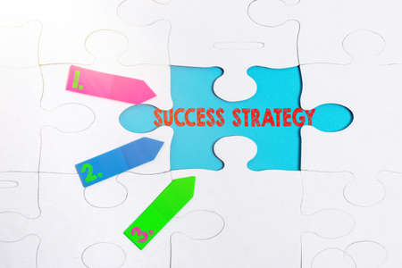 Writing displaying text Success Strategy. Internet Concept provides guidance the bosses needs to run the company Building An Unfinished White Jigsaw Pattern Puzzle With Missing Last Pieceの写真素材