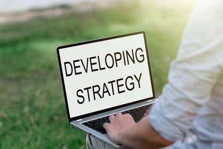 Handwriting text Developing Strategy. Business approach Game plan that sets specific goals and objectives Voice And Video Calling Capabilities Connecting People Togetherの写真素材