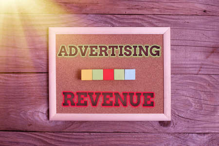 Text sign showing Advertising Revenue. Business showcase money media earn from selling advertising space or time Stack of Sample Cube Rectangular Boxes On Surface Polished With Multi-Colourの写真素材