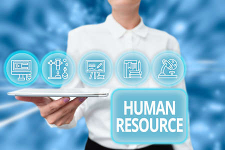 Inspiration showing sign Huanalysis Resource. Conceptual photo the process of hiring and developing employees Lady Uniform Standing Tablet Hand Presenting Virtual Modern Technologyの写真素材