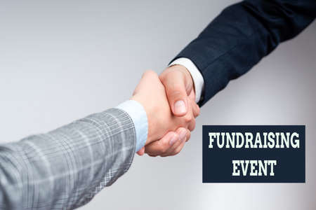 Hand writing sign Fundraising Event. Business concept campaign whose purpose is to raise money for a...