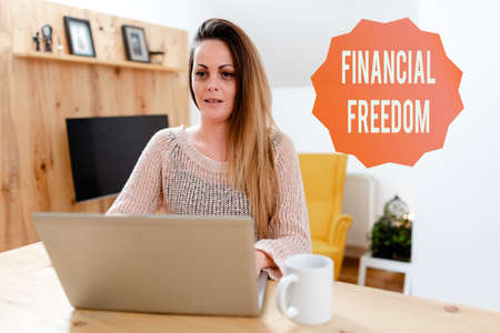 Writing displaying text Financial Freedom. Business concept make big life decisions without being stressed about money Browsing And Chatting In Social Media, Searching And Watching Videosの写真素材