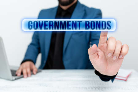 Conceptual caption Government Bonds. Word Written on debt security issued by a government to support...