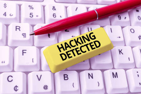 Text caption presenting Hacking Detected. Word Written on identify the presence or unauthorized...